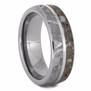 Angled view of titanium cremation ring with meteorite inlay and cremation ash