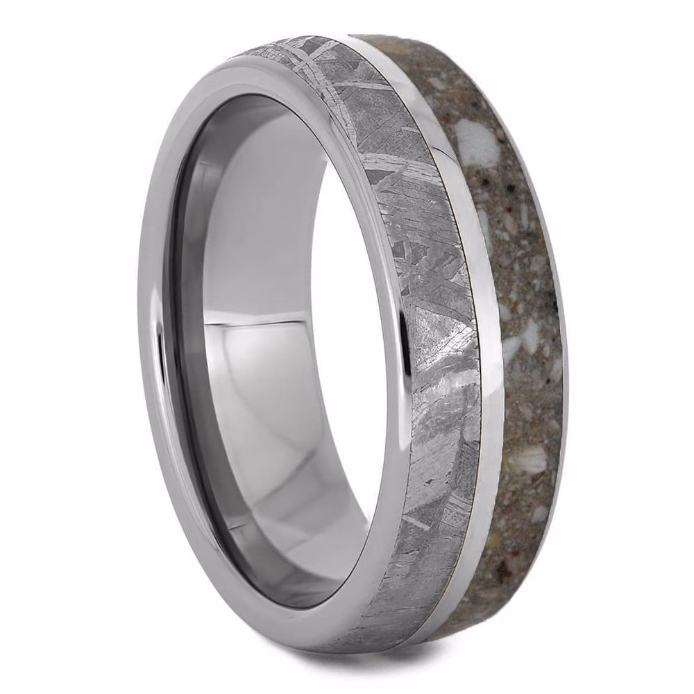 Angled view of titanium cremation ring with meteorite inlay and cremation ash
