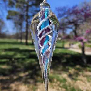 Handmade memorial dewdrop made with cremation ash in purple and aqua.