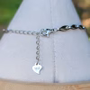 Sterling silver clasp and extender chain on filigree triple stone cremation ash bracelet, showing S925 heart tag