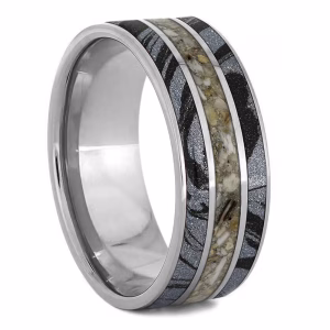 Cremation ring with ashes featuring mokume gane inlays and layered titanium memorial band