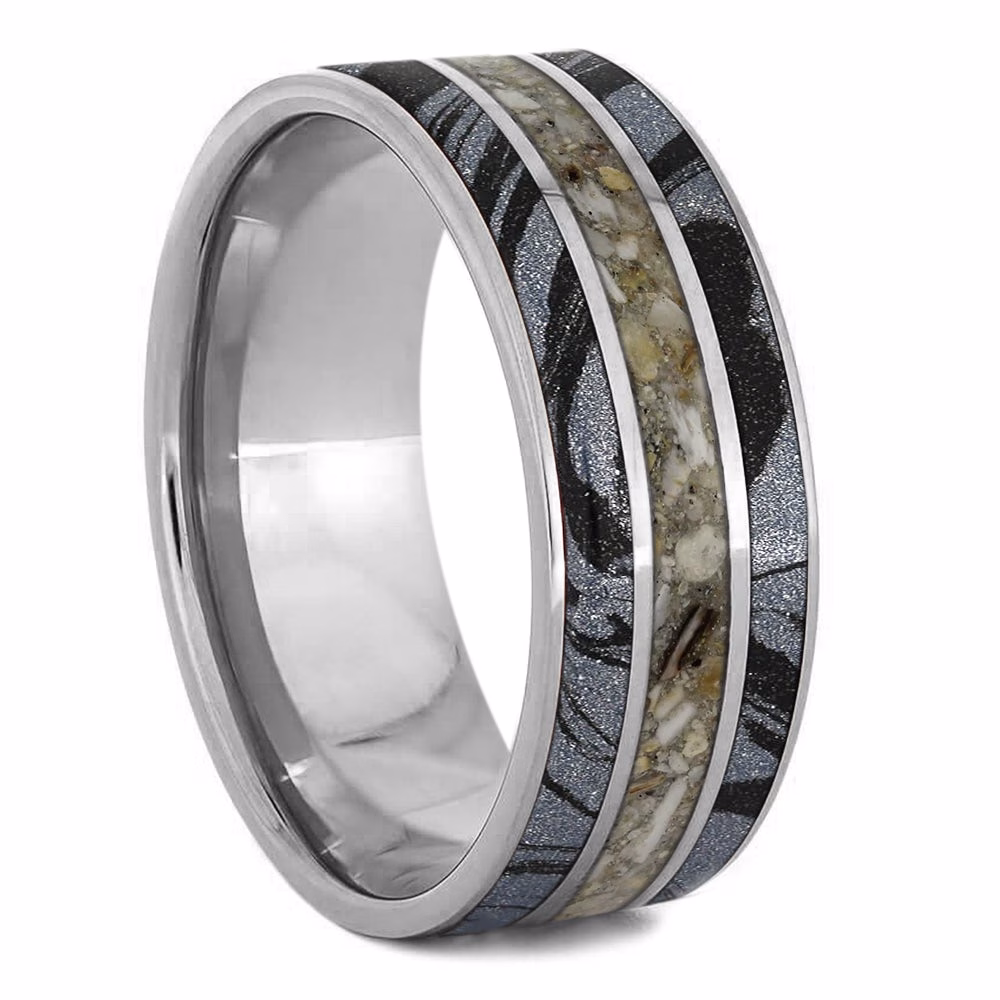 Cremation ring with ashes featuring mokume gane inlays and layered titanium memorial band