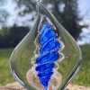 Handmade memorial flame made with cremation ash in blue.