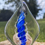 Handmade memorial flame made with cremation ash in blue.