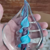 Handmade memorial flame made with cremation ash in purple aqua.
