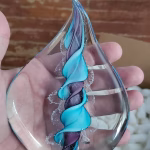 Handmade memorial flame made with cremation ash in purple aqua.