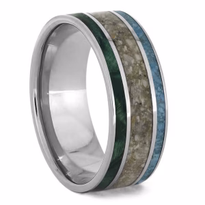 Angled view of triple inlay cremation ring with turquoise, green wood, and cremation ash set in sterling silver