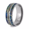 Cremation ring with ashes and flower petal inlays set in polished titanium memorial band, angled view