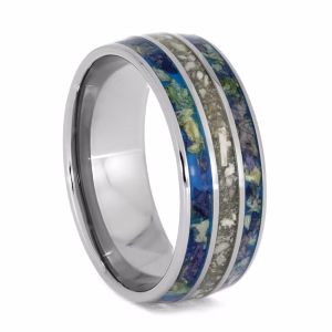 Cremation ring with ashes and flower petal inlays set in polished titanium memorial band, angled side view