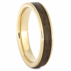 Gold memorial ring with hair or fur inlay, angled view showing polished gold band and preserved keepsake material set flush within the ring