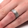 Meteorite cremation ring with ashes worn on hand memorial band close-up