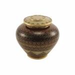Adobe style keepsake urn with bronze finish and engraved decorative patterns