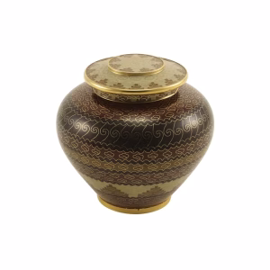 Adobe style keepsake urn with bronze finish and engraved decorative patterns
