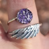 Angel Wing Cremation Ring made with cremation ash set in a sterling silver wing band with purple memorial glass jewel