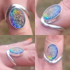 A four-panel collage showing the Bohemian Cremation Ring from multiple angles. The sterling silver band features an organic, curved wrap design surrounding an oval rainbow-iridescent cremation stone with shimmering texture and embedded ash. Views include front, side, tilted, and angled-close perspectives to highlight the ring’s colors and handcrafted details.
