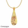 Teardrop cremation pendant in Champagne glass with cremation ash encased inside, shown on a gold-tone chain.