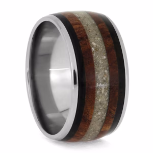 Memorial ring with cremation ashes featuring wood inlay and dark accent bands, angled view showing depth and band profile