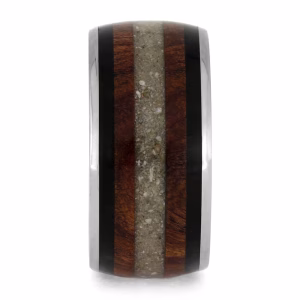 Memorial ring with cremation ashes featuring wood inlay and dark accent bands, straight-on profile view