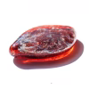 Side view of Galaxy cremation stone made with red memorial glass featuring swirling galaxy pattern