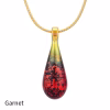 Teardrop cremation pendant in Garnet glass with cremation ash encased inside, shown on a gold-tone chain.