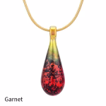 Teardrop cremation pendant in Garnet glass with cremation ash encased inside, shown on a gold-tone chain.