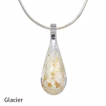 Teardrop cremation pendant in Glacier glass with cremation ash encased inside, shown on a silver-tone chain.