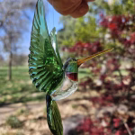 Handmade glass hummingbird made with cremation ash.
