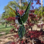 Handmade glass hummingbird made with cremation ash.
