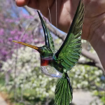 Handmade glass hummingbird made with cremation ash.