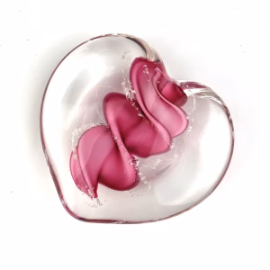 Clear glass eternity heart with soft pink flowing center design, handcrafted with cremation ash.