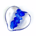 Clear glass eternity heart with deep blue flowing center design, handcrafted with cremation ash.