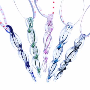 Icicle Ornament with Cremation Ash shown in multiple glass color options including blue, green, purple, ocean blue, and black, displayed hanging on ribbons against a white background