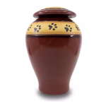 Auburn ceramic pet cremation urn with paw print band and matching lid