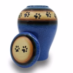 Blue ceramic pet cremation urn with paw print lid and decorative paw band