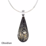 Teardrop cremation pendant in Obsidian glass with cremation ash encased inside, shown on a silver-tone chain.
