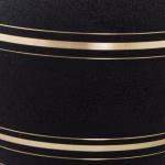 Close-up detail of black onyx cremation urn with gold accent bands