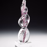 Purple Legacy Flame cremation ash sculpture featuring hand-blown clear glass with elegant swirling purple ribbons, displayed on a polished glass base as a modern memorial art keepsake.