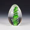 Handmade green eternity egg memorial with cremation ash.