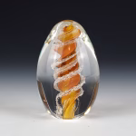 Handmade gold eternity egg memorial made with cremation ash.