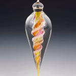Handmade memorial dewdrop made with cremation ash in pink, yellow, and gold.