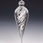 Handmade memorial dewdrop made with cremation ash in black and white.