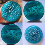 Peacock Blue Clouds Cremation Stone Set glass stone with cremation ash shown in multiple lighting conditions