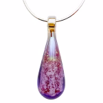 Teardrop cremation pendant with rhodalite purple glass, encased cremation ash, displayed on a silver chain against a white background