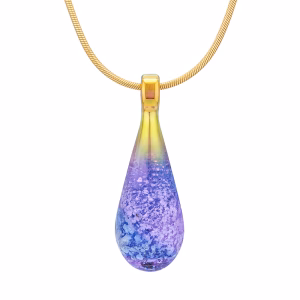Handcrafted spiral teardrop cremation pendant made with cremation ash, featuring layered sapphire blue and amethyst purple memorial glass suspended from a gold-toned chain.