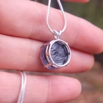 Back view of a sterling silver halo cremation pendant showing the open-backed setting and S925 sterling silver construction.