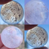 White Clouds Cremation Stone Set glass stone with cremation ash shown in multiple lighting conditions