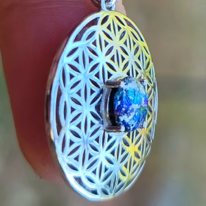 Angled side view of Boho Flower cremation pendant with iridescent glass memorial stone in sterling silver.