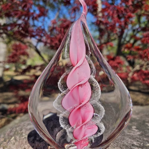 Handmade memorial flame made with cremation ash in pink.