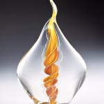 Handmade memorial flame made with cremation ash in gold.