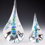 Size comparison of small and large Pyramid Memorial with Cremation Ash in aqua, blue, and green glass